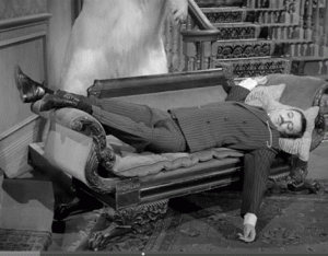 Gomez Addams on an Empire Sofa