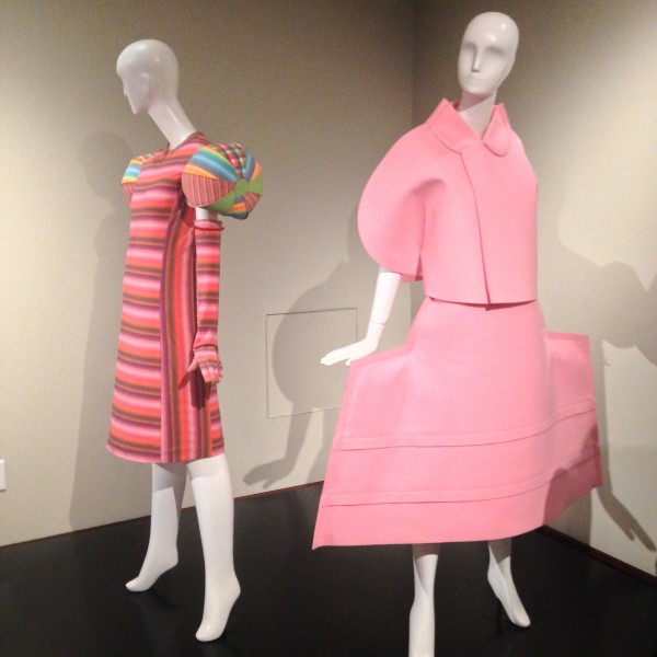 Back: Issey Miyake, Dress, (nylon, polyester, polyurethane) 2001 Front: Rei Kawakubo, Broken Bride Dress (polyester) 2005
