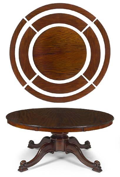 a gigantic Victorian mahogany table with concentric extension